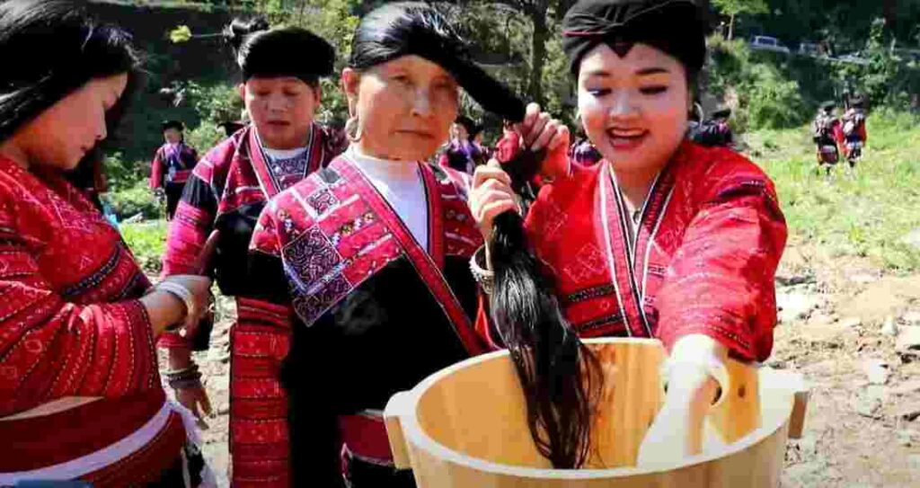 yao women using rice water